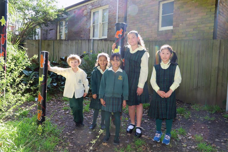 Photograph of students in the playground garden.