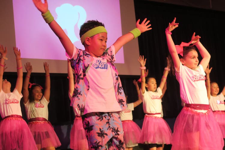Photograph of students dancing during a performing arts showcase.