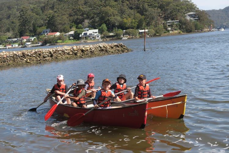 Photograph of students paddling a canoe during Stage 2 camp.