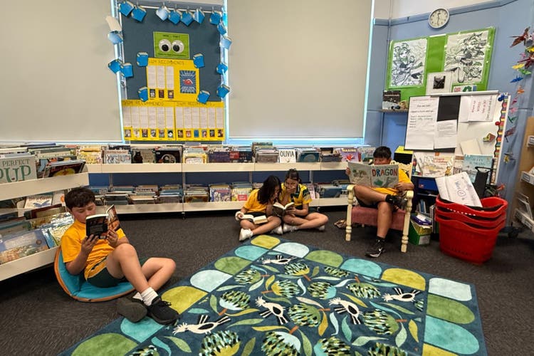 Photograph of students reading in the library.