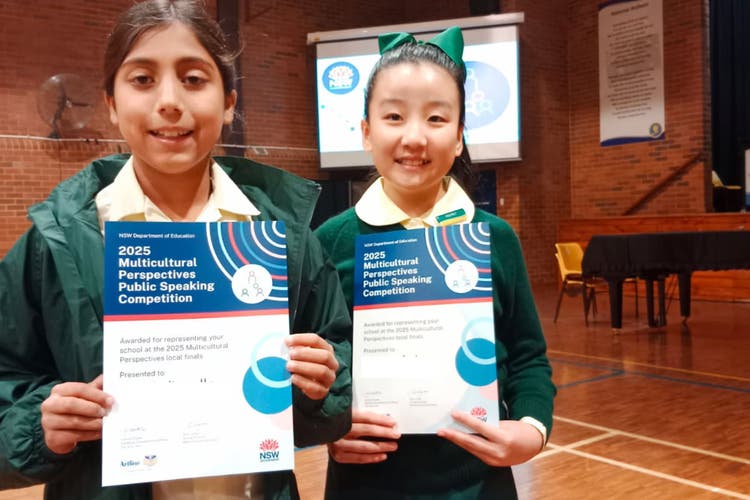 Photograph of two female students who competed in the Multicultural Perspectives Public Speaking competition.