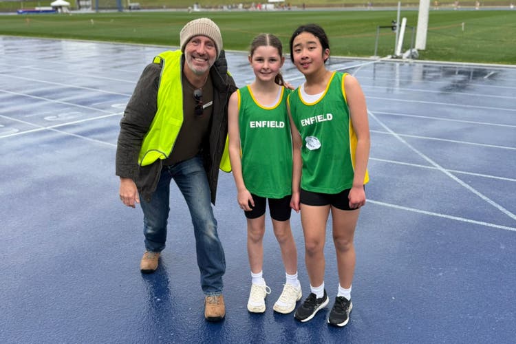 Photograph of school principal with two female students who represented the school in the zone athletics carnival.