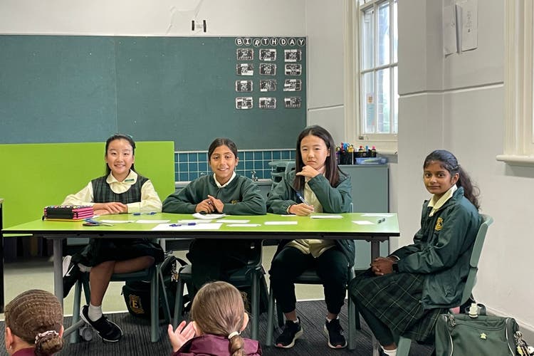 Photograph of the debating team during a debate.