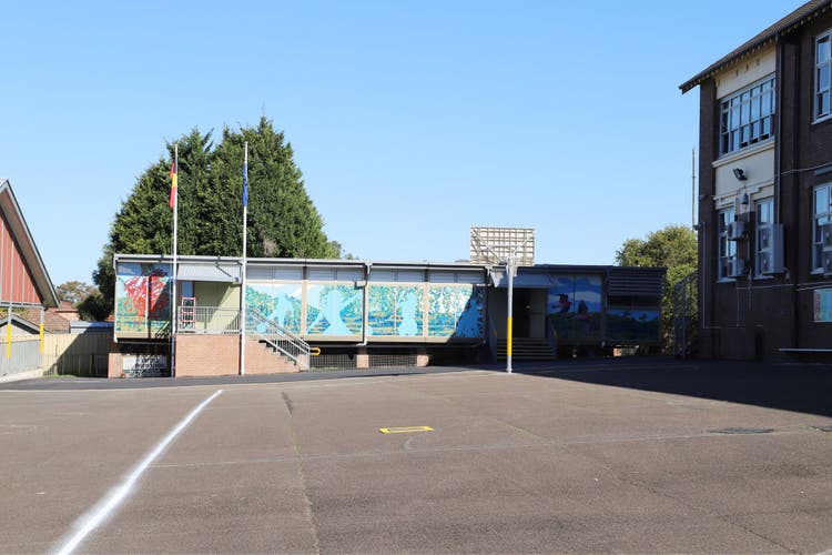 Photograph of school canteen and basketball court.